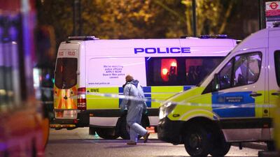 A forensics personnel works the scene. Reuters
