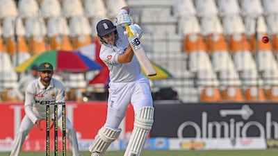 England's Joe Root drives on his way to making 32 not out off 54 deliveries. AFP