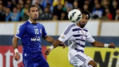 Like other UAE Pro League clubs, Al Ain, in white and purple, have struggled in the Asian Champions League, going down to Esteghlal in their most recent match. Vahid Salemi / AP Photo