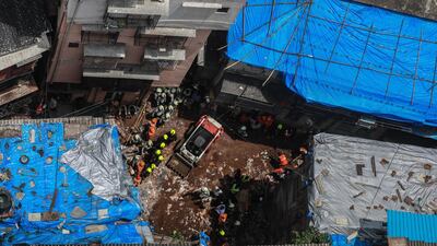 Rescuers working at the site of collapsed building in Dongri, Mumbai. Divyakant Solanki / EPA