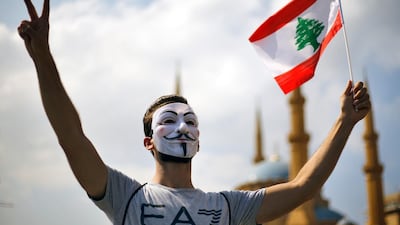 A protester makes a victory sign. Lebanese citizens have been protesting about the country's economic crisis which has worsened over the past two weeks. AP Photo