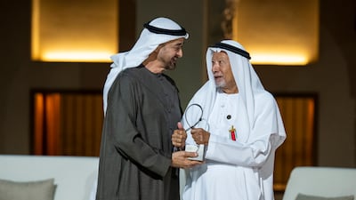 ABU DHABI, UNITED ARAB EMIRATES - November 13, 2025: HH Sheikh Mohamed bin Zayed Al Nahyan, President of the United Arab Emirates (L) presents an Abu Dhabi Award to HE Rashid Abdullah Al Nuaimi, Former Minister of Foreign Affairs of UAE (R), during the Abu Dhabi Awards ceremony at Qasr Al Hosn. ( Abdulla Al Neyadi / UAE Presidential Court ) ---