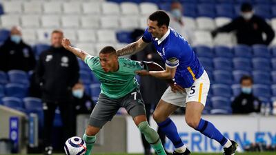 Richarlison tussles with Lewis Dunk during the Premier League match between Brighton & Hove Albion and Everton. Getty Images