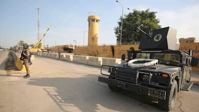 Counter-terrorism forces stand guard at the US embassy in Baghdad last year after a rocket landed nearby.