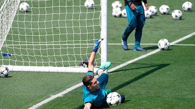 Real Madrid goalkeeper Luca Fernandez makes a save during a training session ahead of the Uefa Champions League final. Gabriel Bouys / AFP