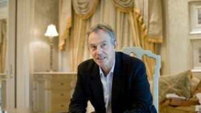 Tony Blair at the Emirates Palace yesterday. "It is essential to get political negotiation moving," he said on the peace process.