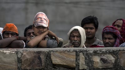 Supporters listen to a speech by BJP leader Narendra Modi at a rally on May 10, 2014 in Robertsganj. Kevin Frayer/Getty Images