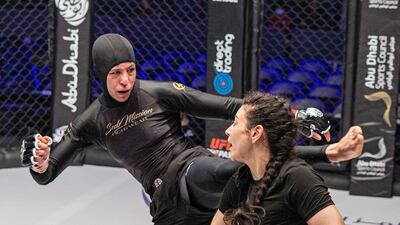 Eman Almudhaf kicks at Rewan Yasser.