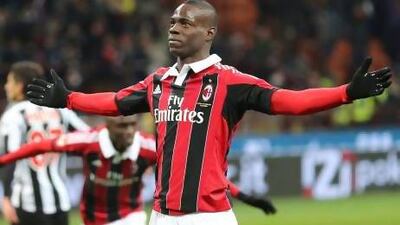 AC Milan forward Mario Balotelli celebrates after scored both goals for his team in a 2-1 win over Udinese on Sunday. Antonio Calanni / AP photo