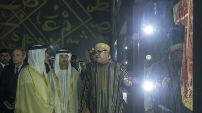 HM Majesty King Mohamed VI of Morocco, right, HH Sheikh Hazza bin Zayed Al Nahyan, UAE National Security Advisor and Vice Chairman of the Abu Dhabi Executive Council, centre, and HH Sheikh Mansour bin Zayed Al Nahyan, UAE Deputy Prime Minister and Minister of Presidential Affairs, left, tour the Moroccan Heritage Week exhibition at the Abu Dhabi National Exhibition Centre (ADNEC). Mohamed Al Hammadi / Crown Prince Court - Abu Dhabi