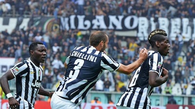 Juventus' Paul Pogba, right, celebrates his goal against Torin. Di Marco / EPA