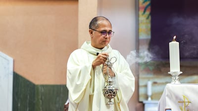 Fr Chito Bartolo, parish priest of St Joseph's Cathedral, during the service