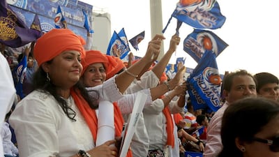 Female IPL fans cheer during a match at Zayed Cricket Stadium in Abu Dhabi. Ravindranath K / The National