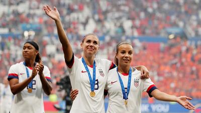 Alex Morgan and Mallory Pugh salute the crowd. Reuters
