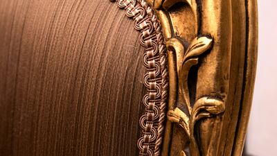 Intricate stitching and carved patterns on one of the dining chairs by Al Atrabi.