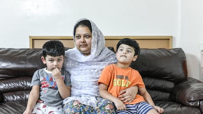 Mahjbeen Ahmed, Mr Ali's wife, with their two sons, Ariz, 3, and Abban, 4. Khushnum Bhandari for The National