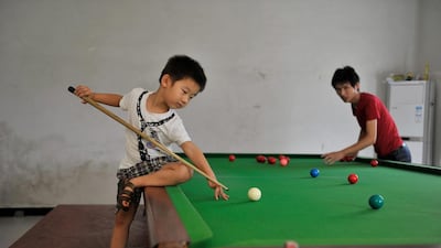 Wuka trains under the careful watch of Wang Yin, his father, a snooker fan who got his son a table when he realised he had the talent. Reuters