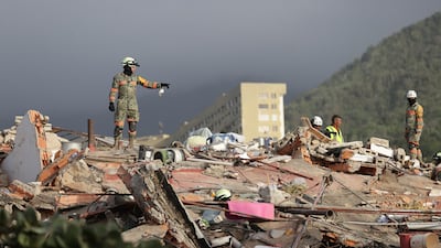 Rescue workers from Mexico at a collapsed building in La Guaira, Venezuela on Friday. Epa