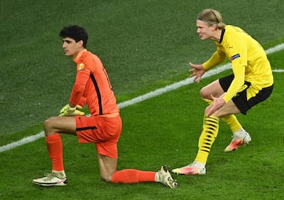 Borussia Dortmund's Erling Braut Haaland celebrates scoring their second goal as Sevilla's Bono looks on. March 9, 2021. Reuters