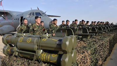Lebanese army soldiers stand next to French anti-tank guided missiles during a handover ceremony in the Lebanese air force military base at Rafik Hariri international airport in Beirut on April 20,2015. France delivered the first tranche of the US$3bn worth of weapons funded by Saudi Arabia on Monday. Wael Hamzeh/EPA