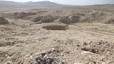 The Khasfa sinkhole in the desert outside Mosul. Up to 4,000 people were killed and buried here by ISIL. Florian Neuhof / The National