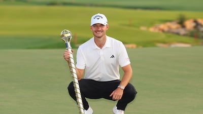 Nicolai Hojgaard of Denmark with the DP World Tour Championship trophy after his victory. Getty Images