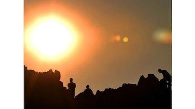 Visitors watch the sun rise on the summer solstice on a rocky crest filled with astronomical markers at the megalithic observatory of Kokino in Macedonia, which is more than 4,000 years old.