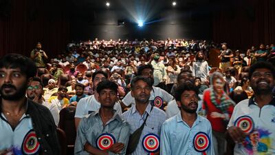 Fans attend the screening of Rajinikanth's new Tamil-language movie Jailer in Mumbai. AFP