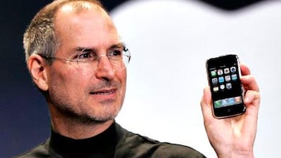 Apple CEO Steve Jobs holds up an Apple iPhone at the MacWorld Conference in San Francisco.. (AP Photo/Paul Sakuma, File)