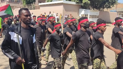 Members of the Sudanese armed popular resistance, which backs the army, parade in the streets of Gedaref in eastern Sudan. AFP