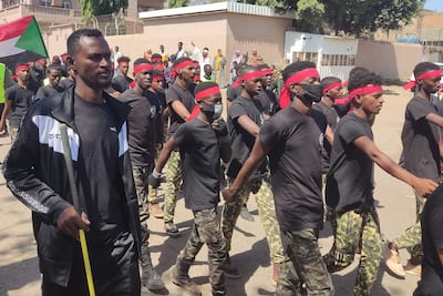 Members of the Sudanese armed popular resistance, which is allied with the army, parade in the streets of Gedaref in eastern Sudan. AFP