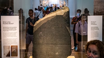 The Rosetta Stone at the British Museum in London. It is inscribed in two languages using three scripts. AFP