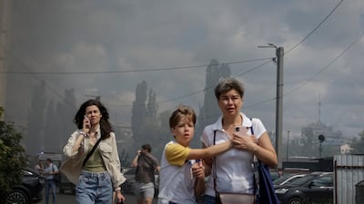 Residents leave the site of a Russian air strike, amid Russia's attack on Ukraine. Reuters