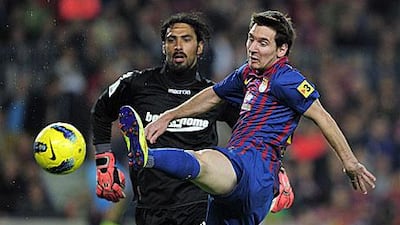 Lionel Messi, the Barcelona forward, volleys past Dudu Aouate, the Real Mallorca goalkeeper, to complete his third hat-trick of the season.