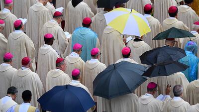 The heavens open as cardinals and bishops attend a beatification mass for John Paul I in the Vatican. AFP
