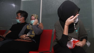Relatives of passengers on board missing Sriwijaya Air flight SJY182 wait for news at the Supadio airport in Pontianak on Indonesia's Borneo island, after contact with the aircraft was lost shortly after take-off from Jakarta. AFP