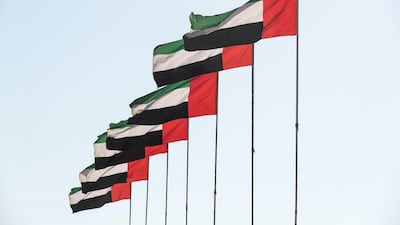 The UAE Flag flies proudly in the winter sunlight in Sharjah. Antonie Robertson/The National
