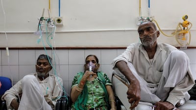 People receive treatment for respiratory issues at a hospital in New Delhi, India. Reuters