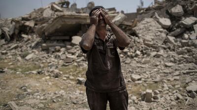 Ammar Mohammed cries while standing next to the body of his daughter, not seen, who died during fighting between Iraqi forces and Islamic State militants in Mosul, Iraq, Saturday, July 8, 2017. (AP Photo/Felipe Dana)