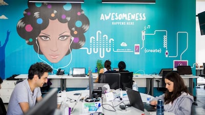 Employees work at Anghami's office in Lebanon. By setting up its global HQ and R&D centre in Abu Dhabi, Anghami will benefit from access to capital, local talent and an R&D support network. Photo: Natalie Naccache / The National