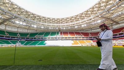 A visitor walks pitch side at the Al Thumama Stadium. Bloomberg