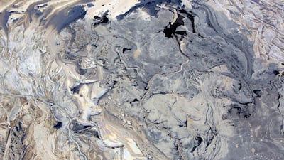 A tar sands mine in Canada. International oil companies are growing dependent on such sources. Brent Lewin / Bloomberg News