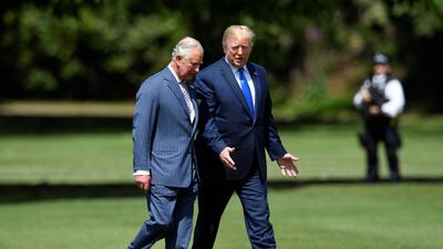 US President Donald Trump (R) walks with Britain's Prince Charles, Prince of Wales (L) as he arrives for a welcome ceremony at Buckingham Palace in central London on June 3, 2019, on the first day of the US president and First Lady's three-day State Visit to the UK. Britain rolled out the red carpet for US President Donald Trump on June 3 as he arrived in Britain for a state visit already overshadowed by his outspoken remarks on Brexit. / AFP / POOL / TOBY MELVILLE