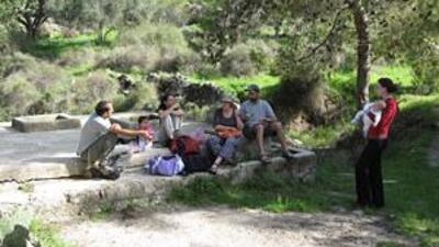 Israelis enjoy a picnic in Canada Park on what were concrete water tanks from the Palestinian village of Yalu until the 1967 war.