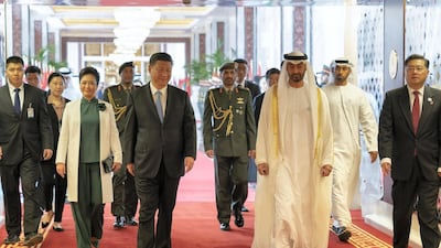 Sheikh Mohammed bin Zayed walks with Xi Jinping at the Presidential Airport. Mohamed Al Hammadi/Crown Prince Court - Abu Dhabi