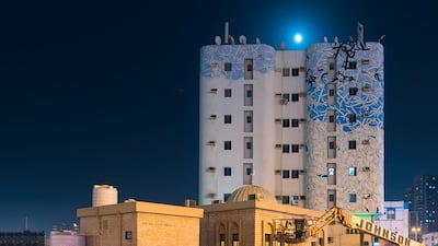 Legibility isn't a priority in El Seed's works (the work pictured is in Ajman). "I want people to reflect on what they are looking at," he told The National earlier this year. "It's super-difficult to read what I write, but if you read Arabic, you will know."