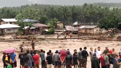People attempt to rescue flood victims in Lanao Del Norte, Philippines. Courtesy Aclimah Cabugatan Disumala / Reuters