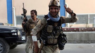Security forces leave after a fighting an ISIL attack on the Iraqi embassy in Kabul on July 31, 2017. Afghan officials say ISIL is offering recruits three times as much pay as government soldiers. Rahmat Gul / AP Photos