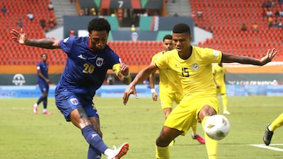 Mozambique's Reinildo attempts to block a cross from Ryan Mendes of Cape Verde. EPA