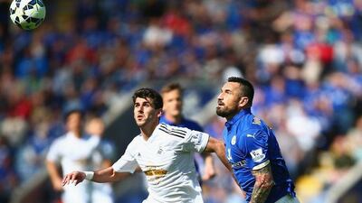 Nelson Oliveria, left, of Swansea City and Marcin Wasilewski of Leicester City battle for the ball during their Premier League match at The King Power Stadium on April 18, 2015 in Leicester, England. (Photo by Jordan Mansfield/Getty Images)